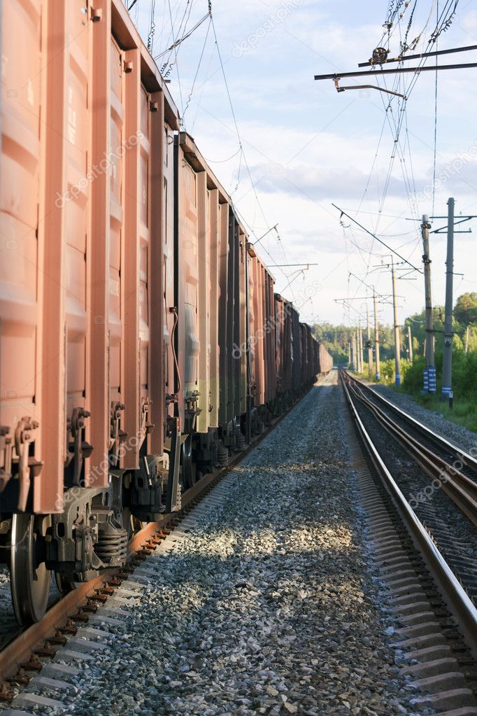 Railway tracks with freight train wagons