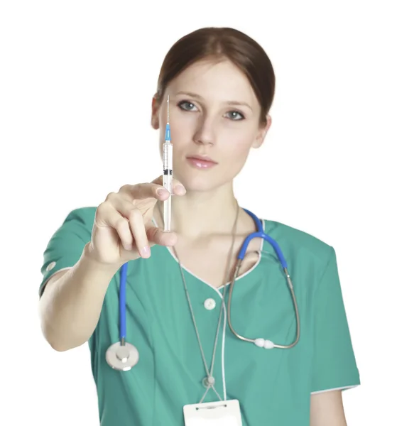 Sjuksköterska anläggning spruta — Stockfoto