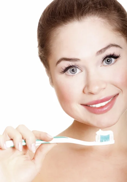 Hermosa chica cepillándose los dientes —  Fotos de Stock