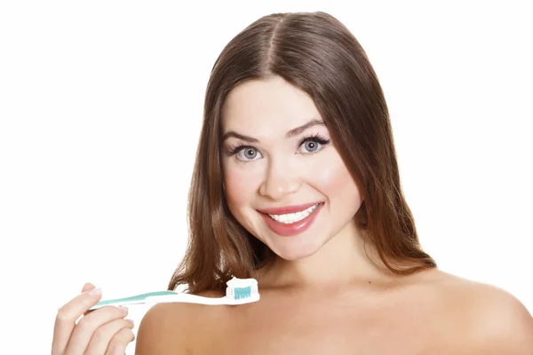 Hermosa chica cepillándose los dientes — Foto de Stock