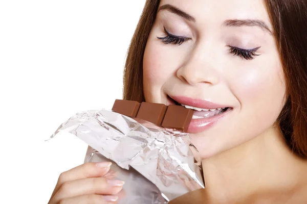 stock image Pretty young woman eating chocolate