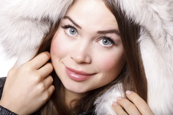 Smiling woman wearing fur Stock Photo