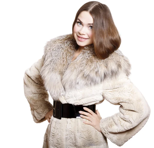 Attractive girl in a fur coat — Stock Photo, Image