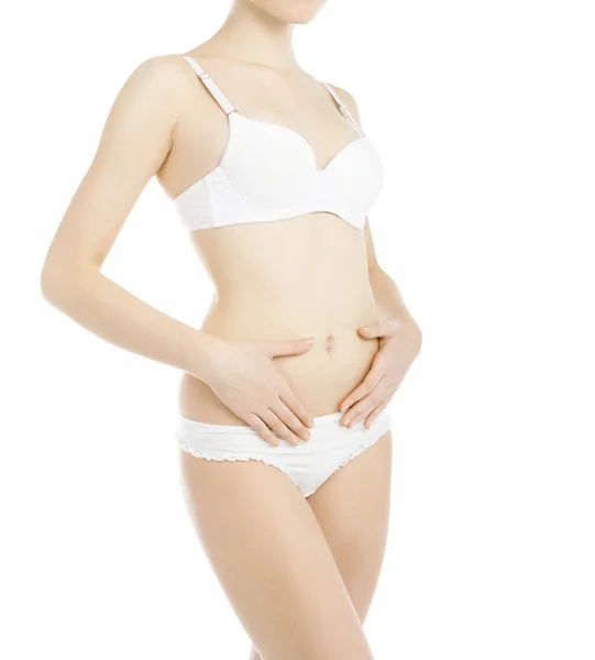 Smal kvinnlig kropp i vita underkläder isolerad på vit bakgrund — Stockfoto