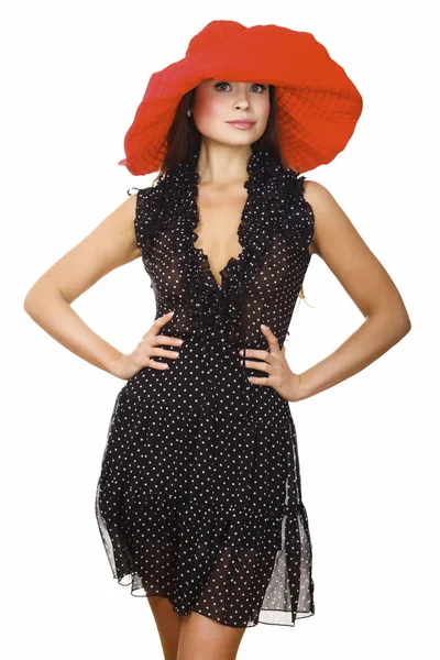 Hermosa mujer joven en vestido negro y sombrero rojo — Foto de Stock