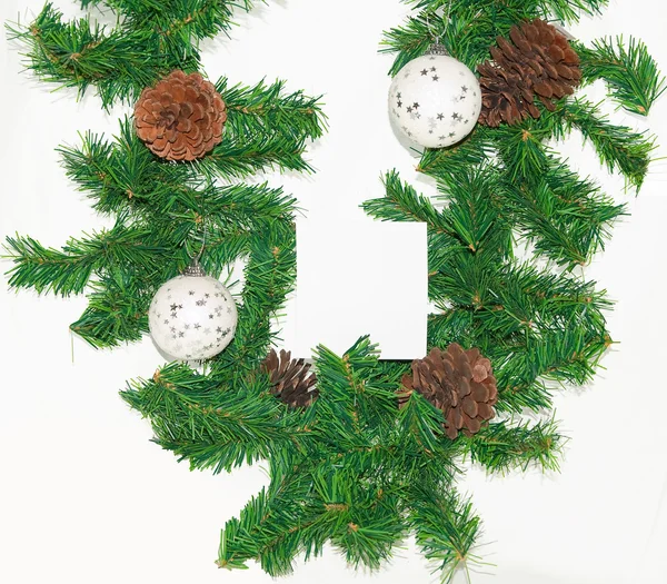 Spruce branches with Christmas balls on white background. — Stock Photo, Image