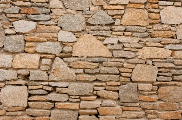 Contexte - un mur de pierres brutes — Photo