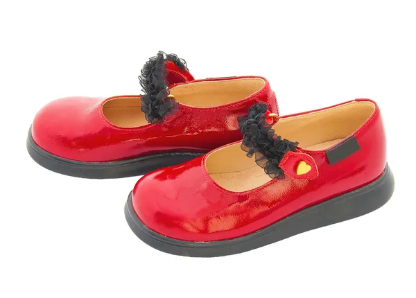 검은 테이프로 붉은 특허 가죽 아기 신발입니다. 절연 — 스톡 사진