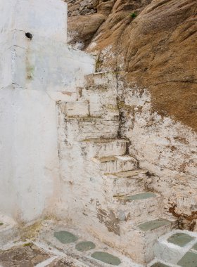 Old ruined stone staircase in the streets of the Greek Islands - a typical clipart