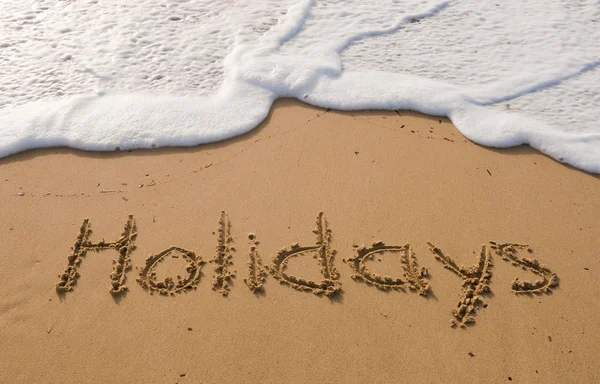 Napis na piasku - wakacje — Zdjęcie stockowe