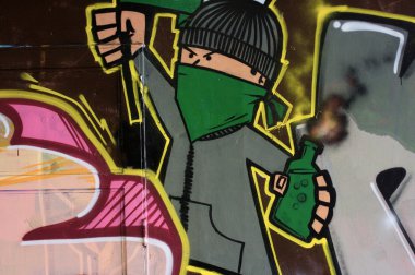 Graffiti on a wall with a terrorist clipart