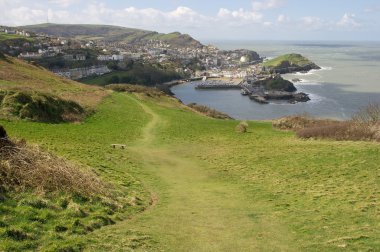 Coastal landscape with an old fishing town clipart