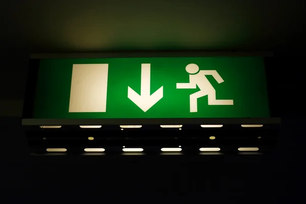 Green Glowing Emergency Exit Sign — Stock Photo, Image