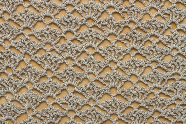 Ahşap tahta üzerinde kumaş tığ işi — Stok fotoğraf