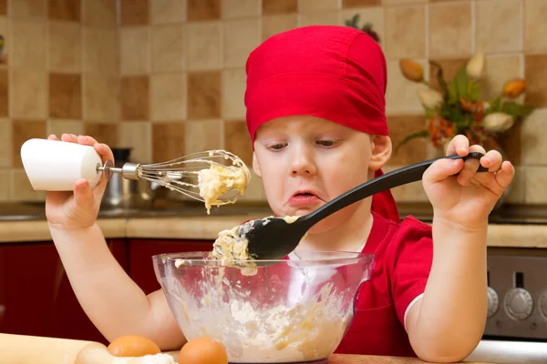 Boy helping at kitchen with baking a pie, little chef — Stock Photo, Image