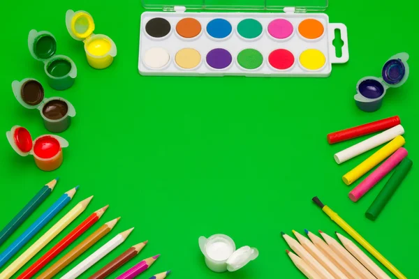Art Supplies Paints Pencils Crayons Brushes Green Background — Stock Photo, Image