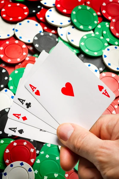 stock image Hand with playing cards on Poker chips background