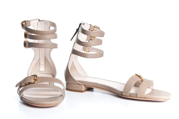 Beigeleather female sandals isolated on white — Stock Photo, Image