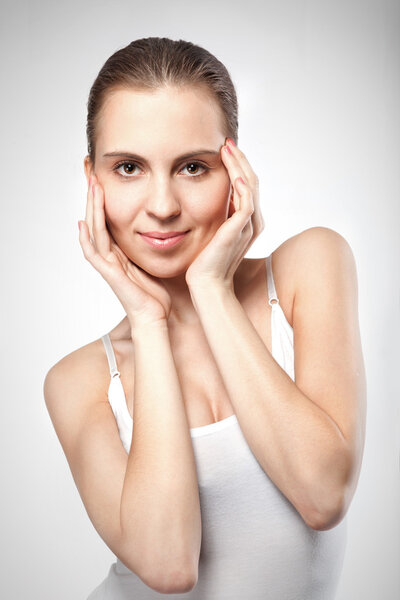 portrait of smiling woman on white