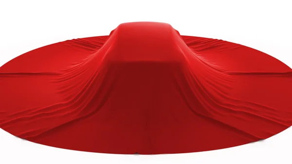 Автомобиль мечты покрыт красной тканью — стоковое фото