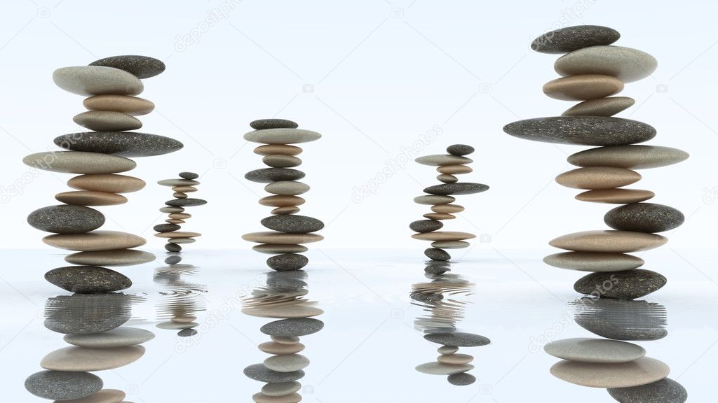 Stability and harmony. Pebble stacks on water