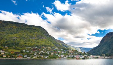 Mountains, village and Norwegian fiord clipart