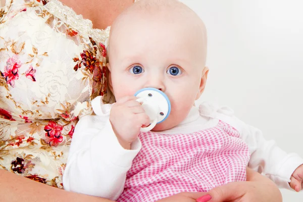 Infant with a pacifier — Stock Photo, Image