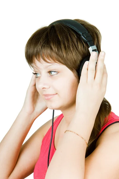 Tjej tonåring i hörlurarna — Stockfoto