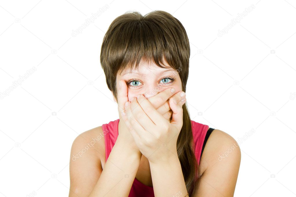 Girl closes her mouth with her hands