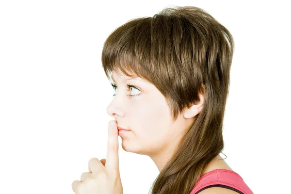 Chica con un dedo presionado en los labios — Foto de Stock