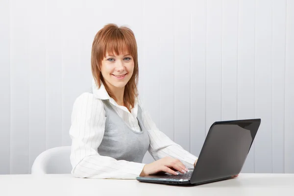 Happy girl with a laptop — Stock Photo, Image