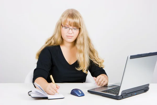 Blonde girl with a laptop — Stock Photo, Image