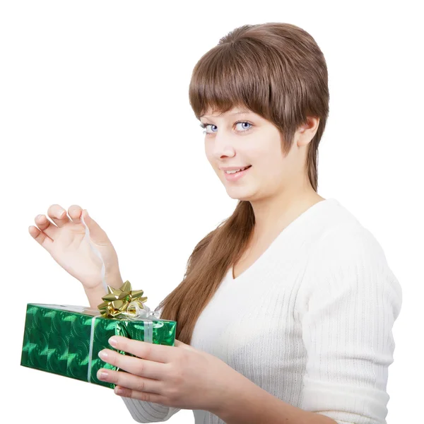 Attractive young woman with a gift on a white background — Stock Photo, Image