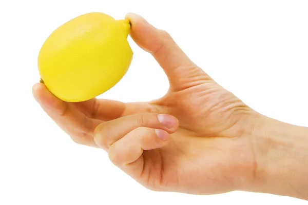 Żółty cytryny w męskiej dłoni — Zdjęcie stockowe