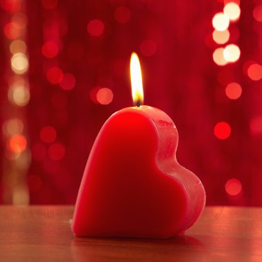 Red burning heart shaped candle clipart