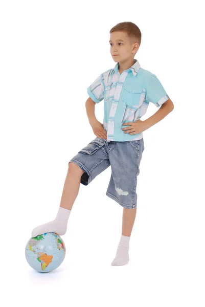 The boy has put a foot on the globe — Stock Photo, Image