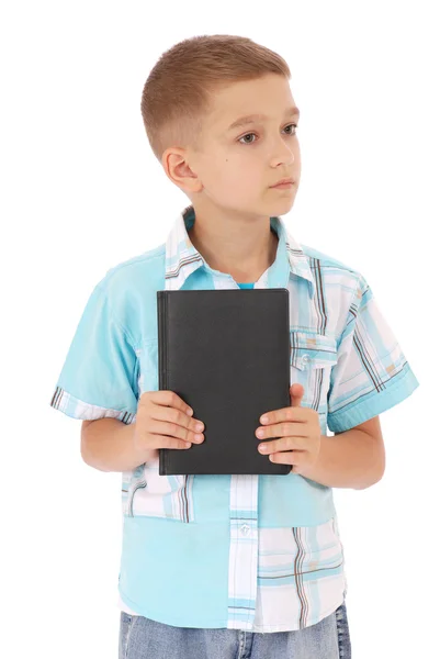 El chico sostiene el libro negro — Foto de Stock