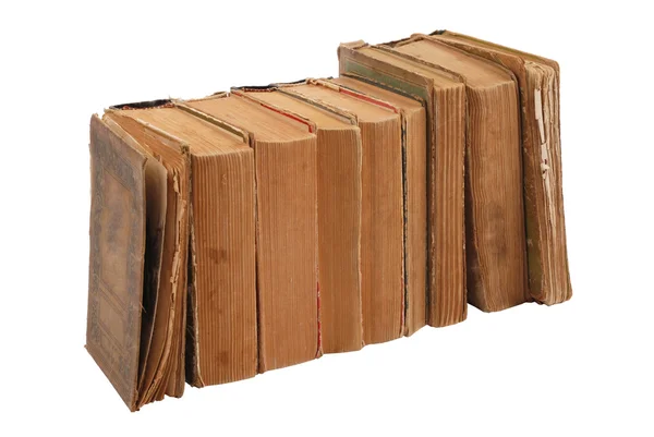 Fila de libros antiguos aislados sobre fondo blanco — Foto de Stock