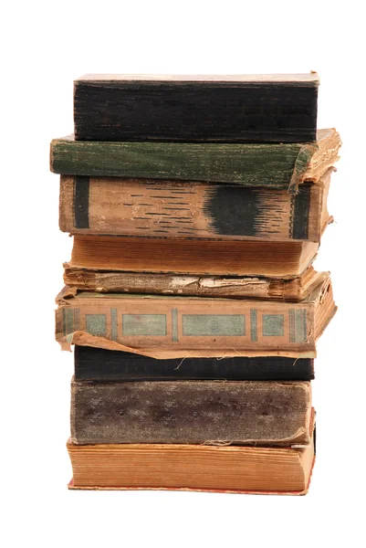 Apilados viejos libros de diferente forma y color — Foto de Stock
