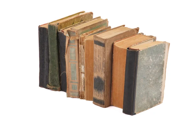 Apilados viejos libros de diferente forma y color — Foto de Stock