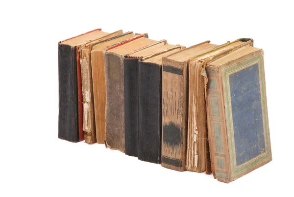Укладаються старі книги різної форми і кольору — стокове фото