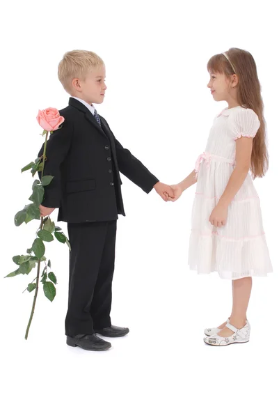 The boy hides a rose behind a back — Stock Photo, Image