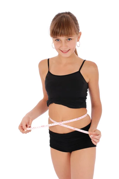 Menina no fundo branco medir a cintura com fita métrica — Fotografia de Stock