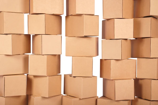 Cajas de cartón apiladas fondo — Foto de Stock