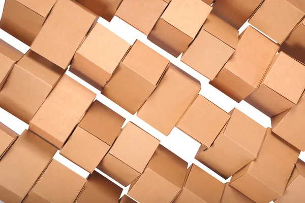 Fundo empilhados caixas de papelão — Fotografia de Stock