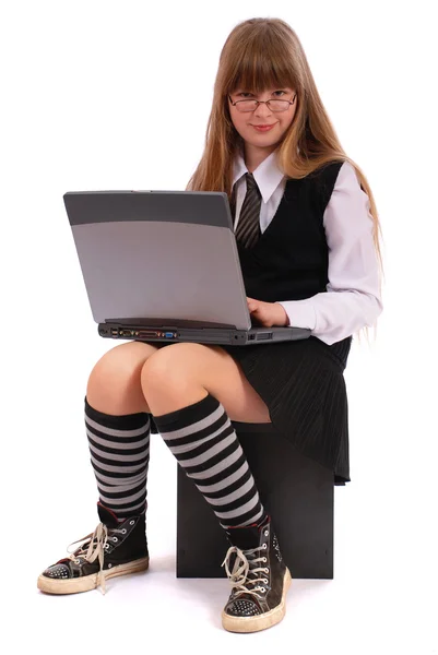 The girl works for laptop — Stock Photo, Image