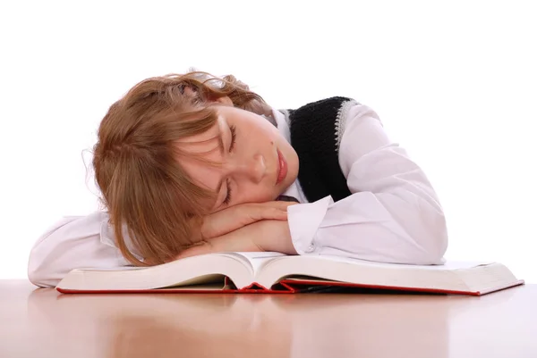 Mädchen ist in der Nähe des Buches eingeschlafen — Stockfoto