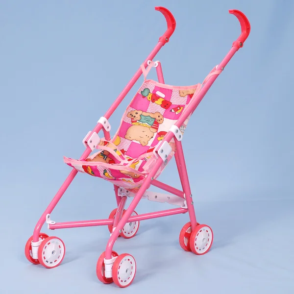 Stock image Toy baby buggy