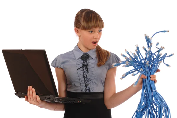 Girl with surprise holds the big sheaf of network cables RJ45 — Stock Photo, Image