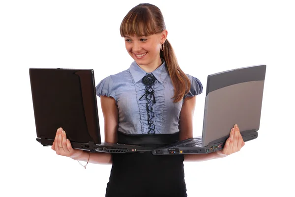 Дівчина тримає два ноутбука — стокове фото
